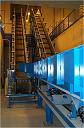 Vibrating conveyor feeding a flexwall conveyor - die cast scrap recovery